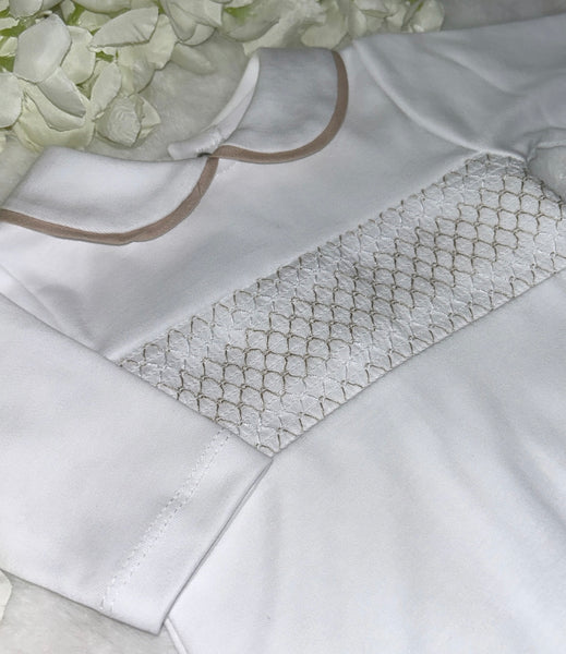 White and beige smocked romper