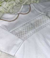 White and beige smocked romper