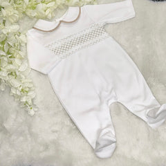 White and beige smocked romper