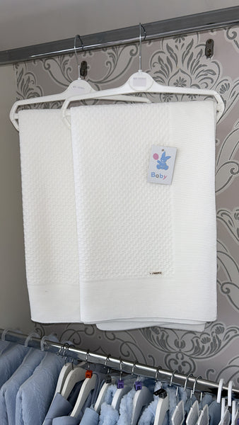 Thick knitted off white blanket