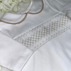 White and beige smocked romper
