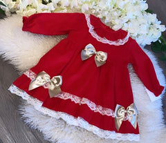 Traditional red dress with cream lace and gold bows