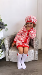 Red knitted cardigan, skirt, beret and socks