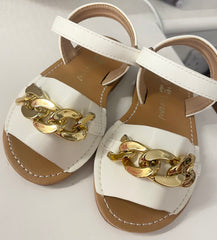 White sandals with gold chain